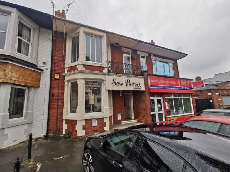 Exterior of Oxford House on Oxford Road, showing the Sew Perfect shopfront and neighbouring businesses